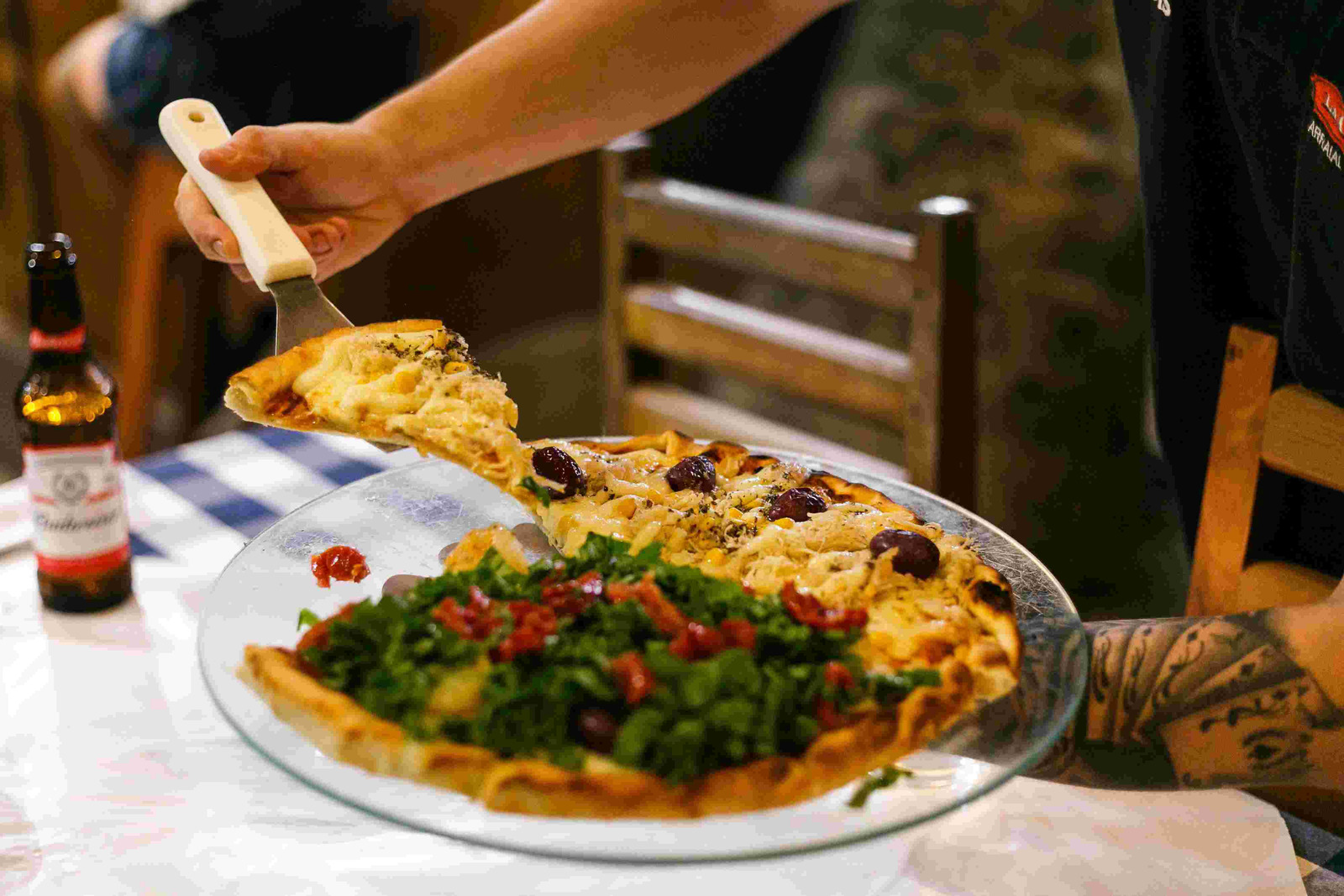 Canva - Person Holding A Plate With Pizza