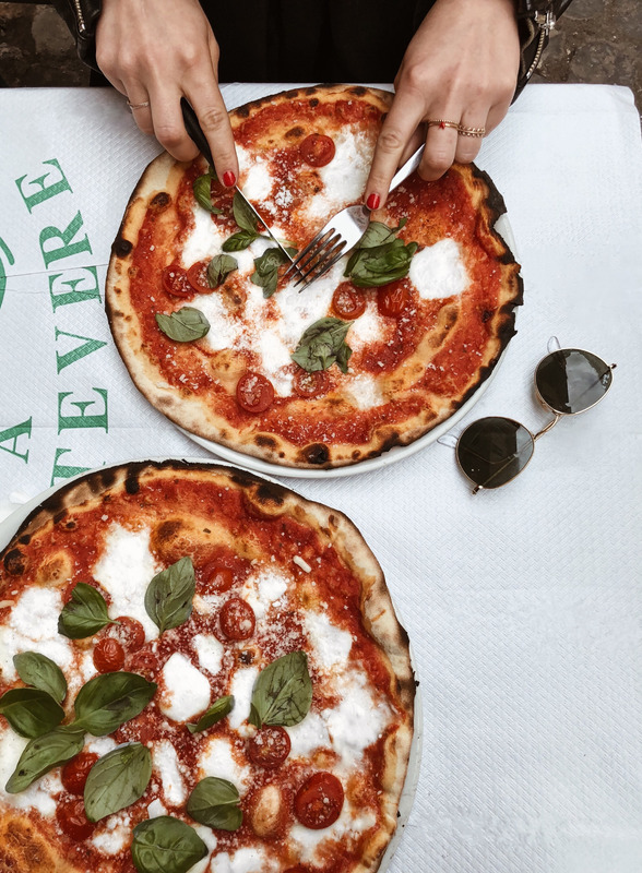 Canva - Person Slicing Pizza